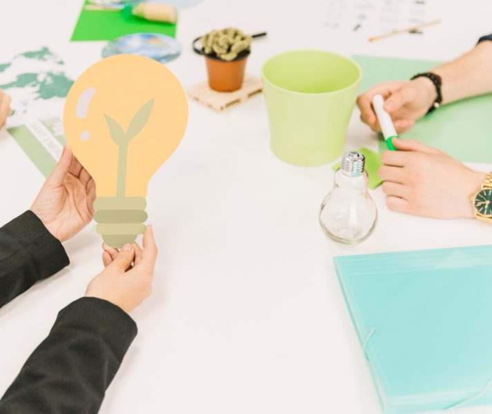 businessperson-s-hand-holding-light-bulb-icon